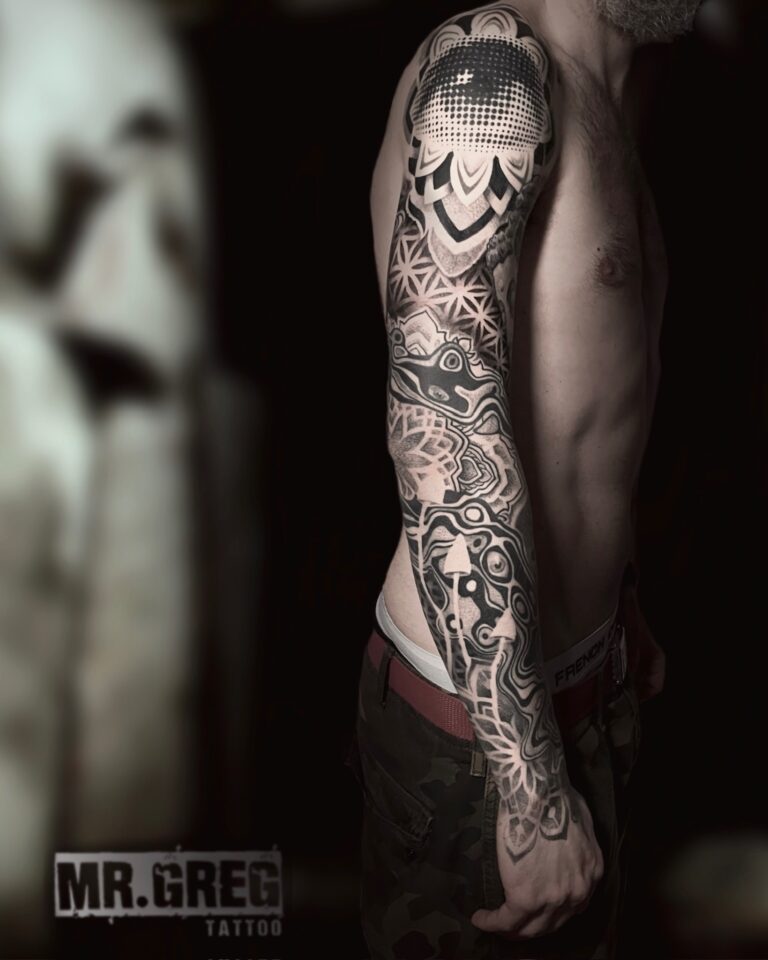 Geometric blackwork sleeve with interlocking patterns